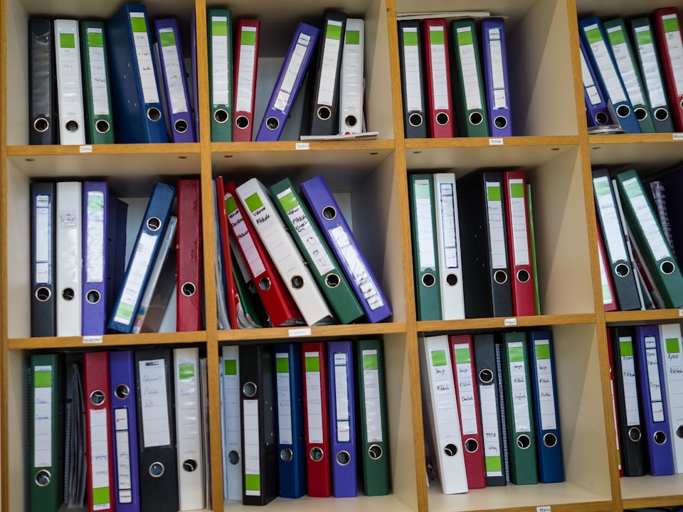 Shelves of labelled binders and folders