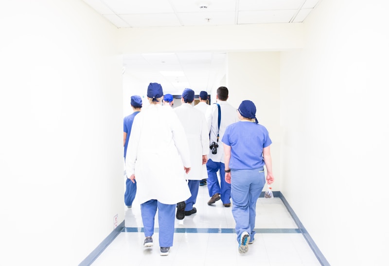 Clinicians walking through a hospital hallway